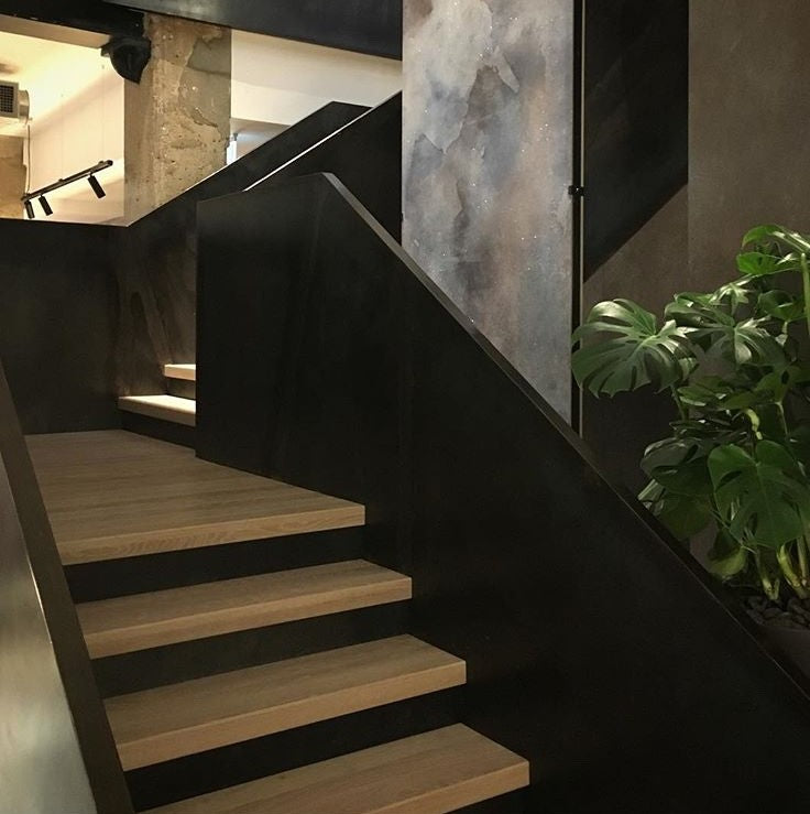 Double plated feature staircase with a blackened patina effect