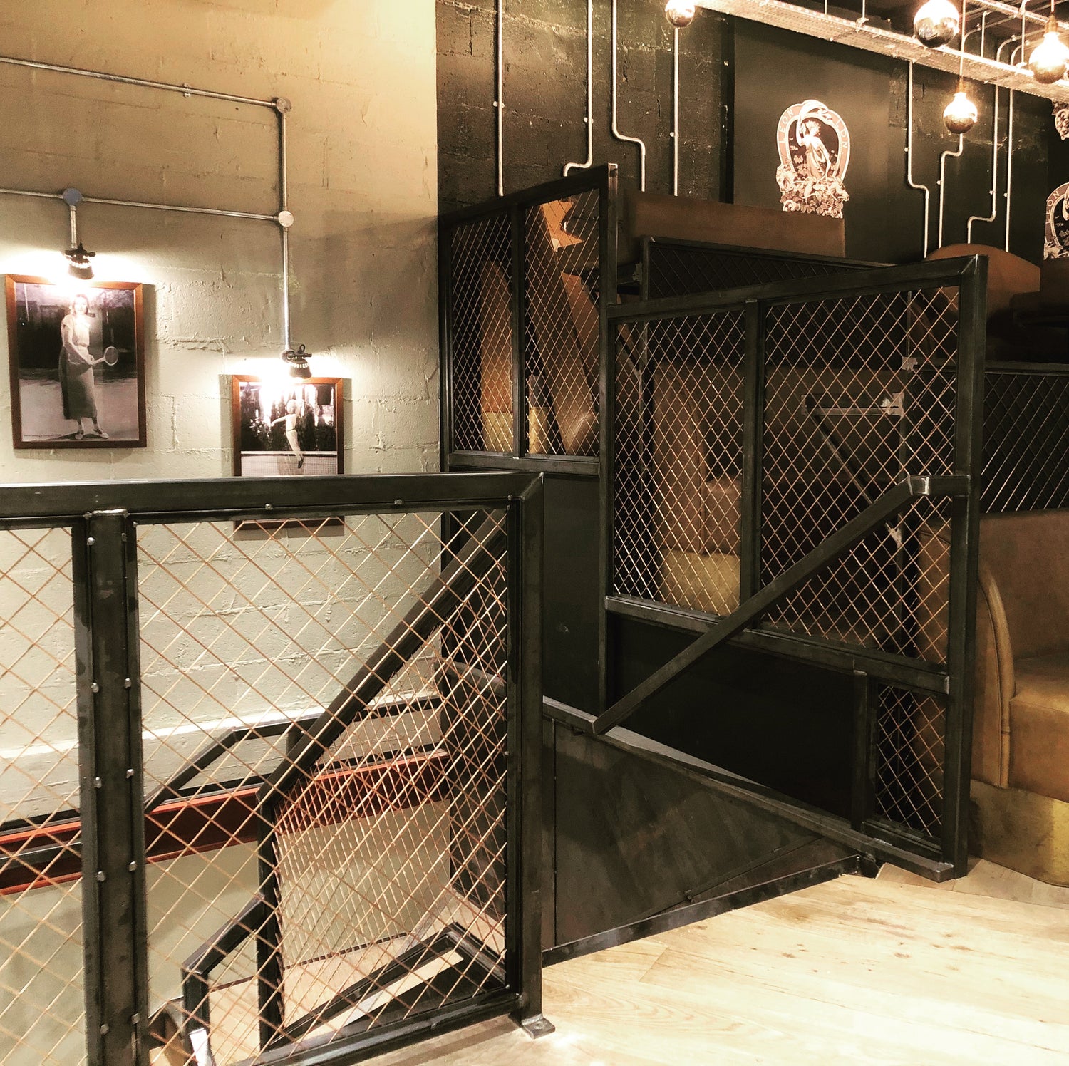 Industrial Style Feature Metal Staircase installed within Leon Restaurant - Mesh balustrade Design