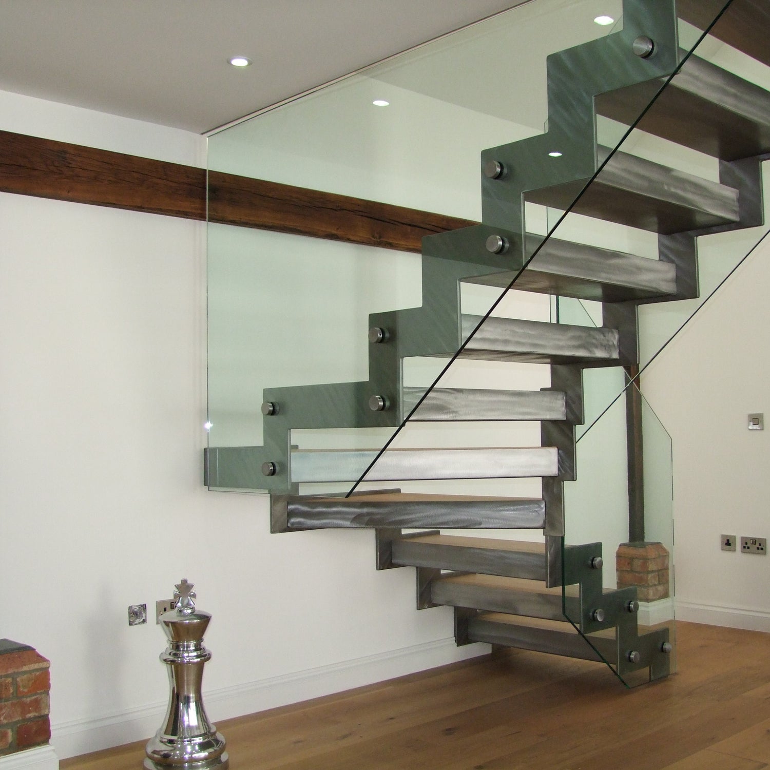 Zig-Zag design Stringer - linished effect with bolted on frameless glass balustrade